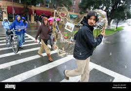 Dan Spalding, right, and Tegra Fisk carry an altar in Berkeley, California, 