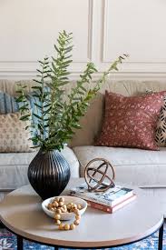 Circular tables have also been popular anchor points for if your living room has global style or elements of boho chic, try using a flat topped vintage trunk as your coffee table. The Basics Of Coffee Table Styling Shades Of Blue Interiors