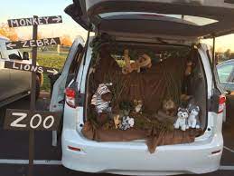 Trunk Or Treat Creative Idea The Zoo Created With Brown Cloth Gardening Stones A Vine Moss From M Halloween Zoo Trunk Or Treat Family Halloween Costumes
