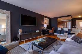 The exact standards on what constitutes a bachelor pad are often ambiguous and debated but one definition describes it as: Before After Modern Bachelor Pad Design Decorilla Online Interior Design Bachelor Pad Living Room Bachelor Living Room Living Room Modern