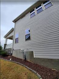 My basement walls are wet above grade on the outside of my house, does anyone know what's causing this? Basement Walls Above Grade Are Wet Outdoors After Rain Home Improvement Stack Exchange