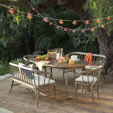 Table Under Strands Of Lights Outdoor Furniture By West Elm Via Emily Henderson Summer Home Decor Outdoor Dining Table Outdoor Dining Set
