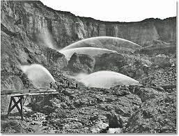 Hydraulic mining developed from ancient roman techniques that used water to excavate soft underground deposits. Hydraulic Mining Techniques California 1870s