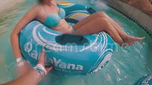 This person must ensure the correct age of child only is allowed on this inflatable and no one over the age specified showed be allowed entrance. Guy With A Girl On An Inflatable Circle Is Swimming In The Pool Pov Aqua Park Stock Video Video Of Child Blue 116900151