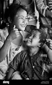ANN TRIBAL CHILDREN laughing in a village near KENGTUNG or KYAINGTONG