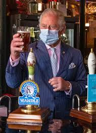 Prince Charles laughs as he struggles ...
