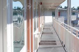 Since it is so versatile, it ranks as one of the most popular porch railing ideas that designers reach to when they want to add an interest piece to a front porch. Perspective Of The Modern Glass And Steel Balcony Deck Patio Stock Photo Picture And Royalty Free Image Image 77381783