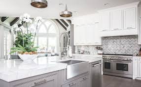 Three ball pendant lamps are hanged above on the white plasterboard it will be another way to have different cabinet color from white kitchen cabinets with quartz countertops on the top part. Two Tone Kitchen Cabinets Ideas Designs Colors Pictures