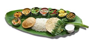 Kumar S Boston Traditional Indian Food Stuffed dough triangle dessert wrapped in banana leaf. kumar s boston traditional indian food