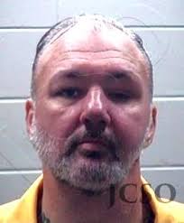 Escaped inmate barricades himself in Leake County home, sets it