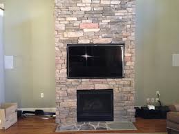 To hide the cords, we used a white extension cord that blends in with our brick and wall paint and traced it along the mantle and brick, all the way down the wall and to the outlet. Flat Screen Installation On A Brick Wall Or Fireplace Neuwave Systems