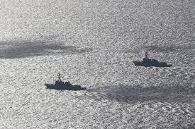 Two U.S. Navy guided-missile destroyers, identified as the Pentagon as the  USS Frank E. Peterson (DDG-121) and USS Michael Murphy (DDG-112), passed  through the Strait of Hormuz on Saturday, according to three
