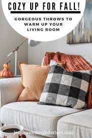 This cozy family room looks perfect for a night in with a movie. Fall Living Room Decor Cozy Throw Pillows Blankets Jessica Welling Interiors