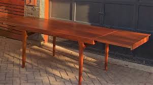 The table has good bones but the surface is incredibly damaged. Danish Mid Century Modern Teak Draw Leaf Extension Dining Table Unusual Design Please Help To Id Identification Design Addict Forum