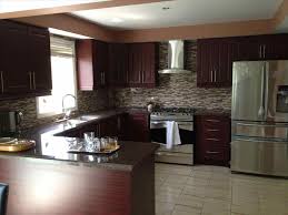 Make dark wall cabinetry less intrusive in a small kitchen by using it only along lower wall sections. 29 Fabulous Kitchen Design Ideas With Dark Cabinets That Will Make You Feeling Comfort Home Diy Ideas Kitchen Remodel Small Kitchen Layout Kitchen Cabinet Design