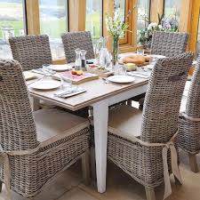 The unexpected pairing of rattan with the white. Savannah Reclaimed Wood Extending Rattan Dining Set Modish Living