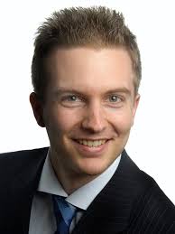 Deceleration of High-Velocity Interstellar Photon Sails into Bound Orbits  at α Centauri Using Photogravitational Assists