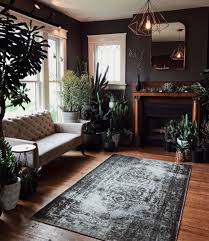 This Is A Living Room I Need In My Life I Love The Vast Amount Of Plants That Are Everywhere And Love That Dark Living Rooms Moody Living Room House Interior