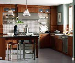 See the before and after pictures of this farmhouse kitchen renovation with dark wood cabinets, quartz countertops and tile floors. Kitchen With Cherry Cabinets Kemper Cabinetry