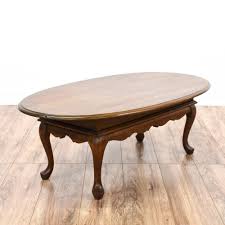 Oval Queen Anne Coffee Table This Oval Coffee Table Is Featured In A Solid Wood With A Glossy Oak Finish T Coffee Table Coffee Table Wood Stone Coffee Table
