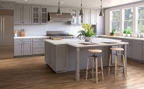 Metal pulls on the cabinets and drawers add shine to the room. Nova Light Grey Shaker Wood Cabinet Factory Nova Light Grey Shaker Cabinets