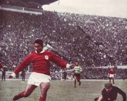 Benfica goal ace Eusebio scores against rivals Sporting Lisbon in 1964.