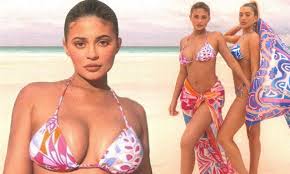 Kylie Jenner flaunts her figure while posing on the beach in a  candy-colored bikini | Daily Mail Online