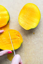 If you feel like the knife is slicing into the pit and meeting some resistance, simply move it out a bit. How To Cut A Mango Fed Fit