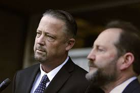 Discipline unlikely for officers' offensive texts, judge says