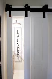 Above sink i would want a window by the sink and also a tall cabinet by the door for laundry. Laundry Room Barn Door Designed Simple