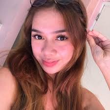 Ronalyn Cariaga, widow of murdered Frank Anthony Gregorio, cries in her  late husband's and mother-in-law Sonya Gregorio's wake at their residence  in Paniqui, Tarlac