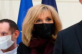Supportive yet discreet, strong but without ambition, the president's wife is a huge hit in a country which reveres alluring older women. Brigitte Macron Makes First Post Coronavirus Appearance In Coat Dress Footwear News