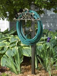 Make sure this fits by entering your model number.; Garden Hose Holder Station By Whitehall Products
