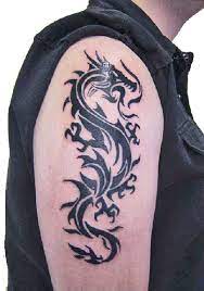 Dragon tattoos are popular with men and are usually considered to be a masculine design. Tribal Dragon Tattoos Designs Art Pictures Images Photos Ink Flash 14 Dragon Tattoos For Men Tribal Dragon Tattoos Tattoos