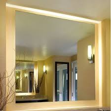 Frameless mirror next to mirror tile alongside thick countertops and bathroom mirrors and lights. Luxury Frameless Wall Mirrors Perigold