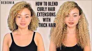 The extensions are secured by sandwiching the tape between. How To Blend Curly Hair Extensions With Thick Hair Youtube