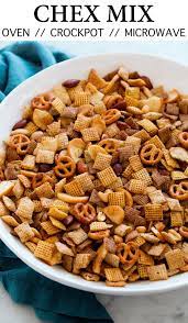 Easy Classic Chex Mix Includes Options To Cook In Microwave Oven Or Slow Cooker A Delicious Recipe Made With Th Chex Mix Recipes Chex Mix Snack Mix Recipes