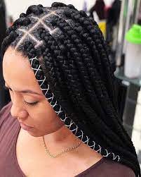 Cornrow Braid Hairstyles On Black Hair Woman Wearing A Purple Top Gold Necklace Nigerian Braids Hairstyles Summer Braids Ghana Braids