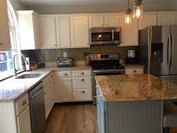 The kitchen together using its cabinets forms a particular kind of attraction in the places where you might be living. Cabinets Are Benjamin Moore Navajo White And Island Is Benjamin Moore Chelsea Gray Wall Color Is Valspar Oatla Kitchen Cabinets Kitchen Remodel Kitchen Design