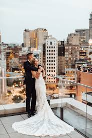 Classic Detroit Photo Of A Bride And Groom On Their Wedding Day Admiring The City Skyline From Wedding Photography Bride Skyline Wedding Detroit Wedding Photos