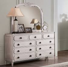 This charming chest of drawers boasts a sturdy construction of solid mahogany and engineered woods. Esther Antique White Dresser