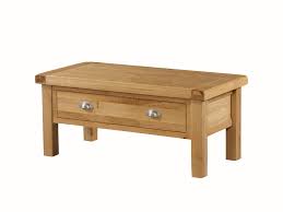 This large coffee table includes one lower drawer with silvertone metal pulls and a large open shelf for displaying photos or storing magazines. Newbridge Solid Oak Small Coffee Table Solid Oak