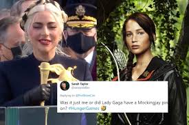 For all the quips about how it looks as if he is her grandfather and how her outfit was a bit hunger games, they are a powerful union of pop appeal and politics. Mockingjay Is That You Lady Gaga S Inauguration Outfit Gave Twitter Major Katniss Everdeen Vibes