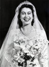 Queen elizabeth's coat of arms. This Is How Much It Cost To Replicate Queen Elizabeth S Wedding Dress For The Crown Queen Elizabeth Ii Wedding Royal Wedding Dress Royal Weddings