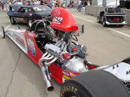 Rear wheels large rear high traction white letter belted drag racing tires with medium compound foams. Super Comp Drag Racing Engine Builder Magazine