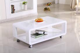 Another distinctive characteristic of its design is the wire mesh shelf placed at the bottom. White High Gloss Coffee Table On Wheels Homegenies