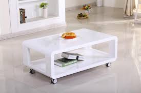 A coffee table with wheels can move around your home as needed for added convenience. White High Gloss Coffee Table On Wheels Homegenies