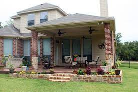 Comfortable Covered Porch With Adjacent Grilling Station Patio Brick Columns Covered Patio Covered Patio Design
