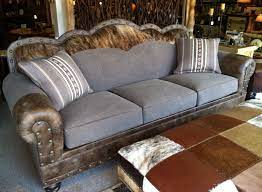 Brass nailhead trim on the arms adds a decorative touch. Wyatt Sofa With Gray Brown Denim Leather And Cowhide And Nail Stud Trim Studded Leather Couch Denim Sofa Sofa