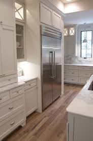 Tasha B Davis Interiors Custom Kitchen White Shaker Cabinets Built In Refrigerator White Marb Hardwood Floor Colors White Oak Floors Built In Refrigerator